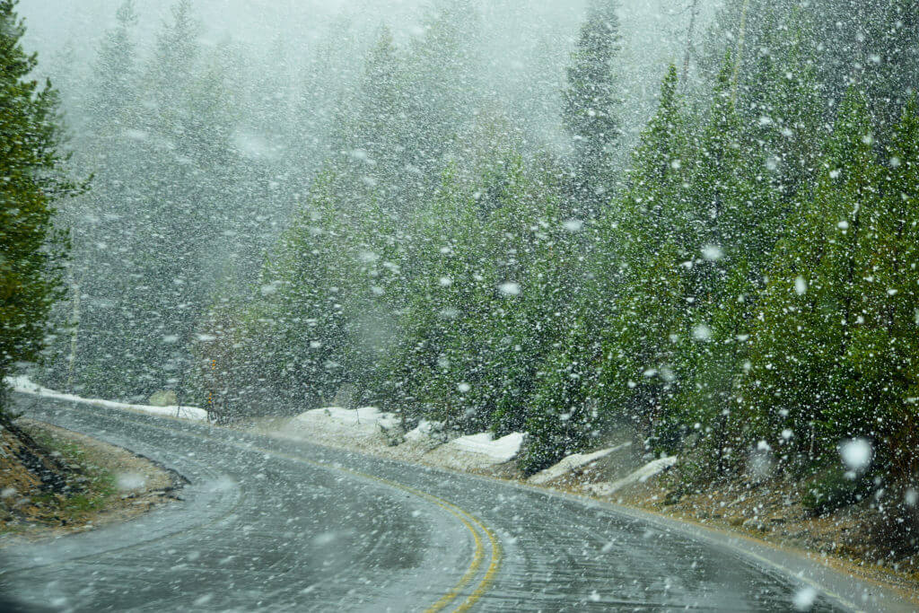 snowy conditions on curvy mountain road